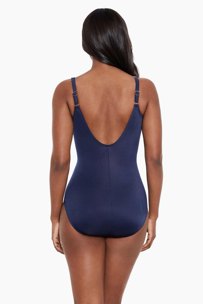 Model wearing 'Oceanus' Swimsuit in Midnight Blue & White, from the Tropica Toile collection by Miraclesuit (back view).