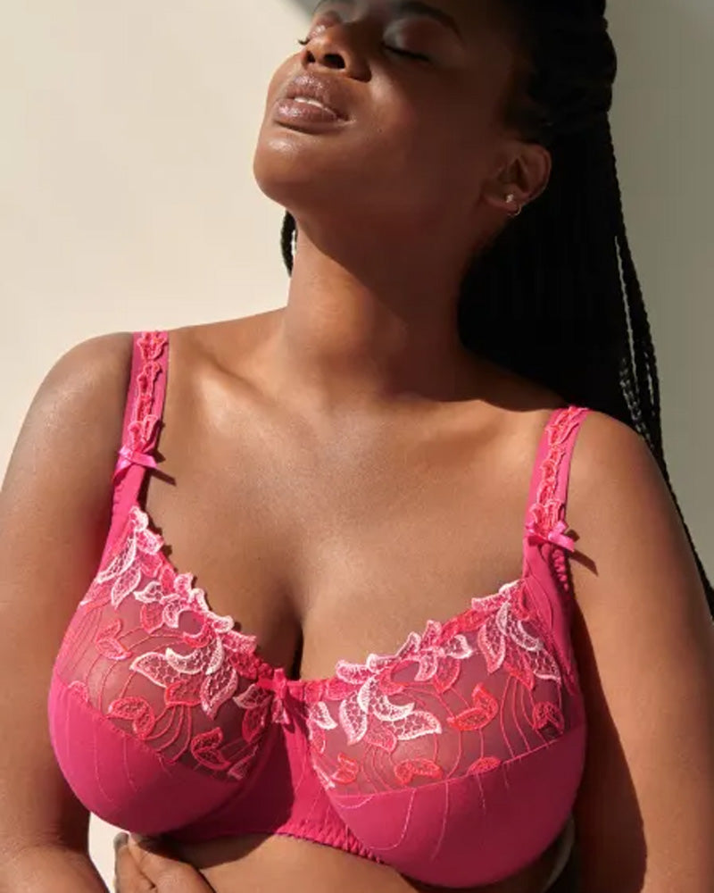 PrimaDonna model wearing bright pink full cup Deauville bra, enjoying the sunshine.
