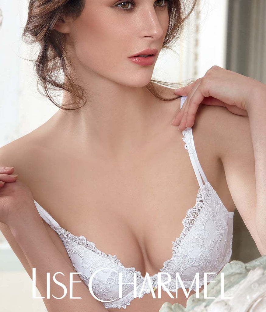 Model wearing 'Dressing Floral' lingerie in white by Lise Charmel.