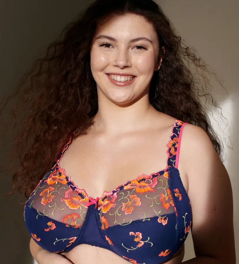 Smiling plus-size model wearing PrimaDonna full cup bra.