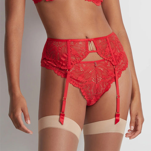 Model wearing red 'Flowermania' Suspender Belt, by Aubade.