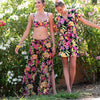 Models wearing 'La Feminissima' swimwear in Rose Améthyste (Floral on Black), by Antigel.