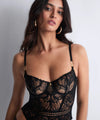 Model wearing 'After Hours' Black Basque, by Aubade (front view).