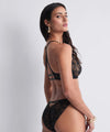 Model wearing 'After Hours' Black Italian Brief, by Aubade (side view).
