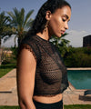 Model wearing 'By The Sea' Black Tank Top, by  Aubade (side view).