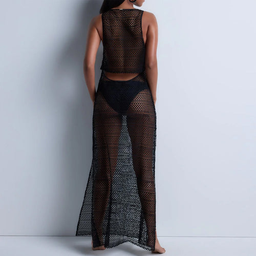 Model wearing 'By The Sea' Black Dress, by Aubade (back view).