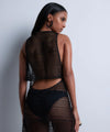 Model wearing 'By The Sea' Black Dress, by Aubade (back view).