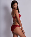 Model wearing 'Danse des Sens' Italian Brief in Irresistible Red, by Aubade.