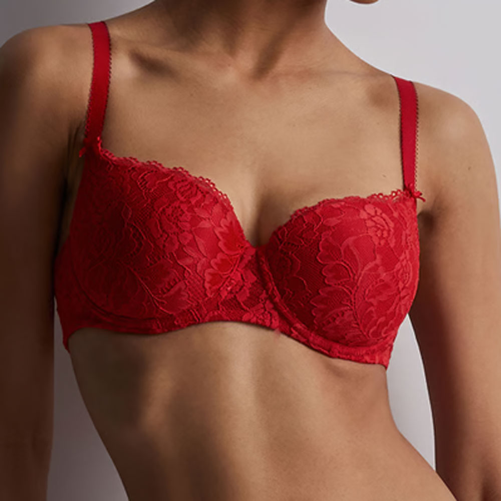 Model wearing Aubade 'Rosessence' Red Comfort Moulded Half Cup Bra.