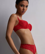 Model wearing Aubade 'Rosessence' Red Comfort Moulded Half Cup Bra.