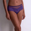 Model wearing 'Illusion Fauve' Cheeky Brief in violet, by Aubade (front view).