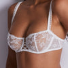 Model wearing 'Kiss of Love' White Half Cup Bra, by Aubade.