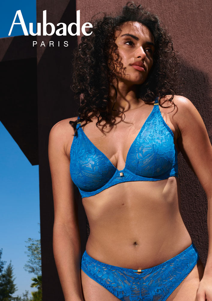 Model wearing 'Love Soul' Blue Plunge Triangle Bra, by Aubade.