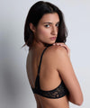 Model wearing 'Love Soul' Black Plunge Triangle Bra, by Aubade (back view).