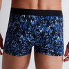 Model wearing 'Fleur Bleue' Blue Boxer Short, by Aubade (back view, close up).