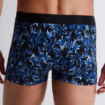 Model wearing 'Fleur Bleue' Blue Boxer Short, by Aubade (back view, close up).