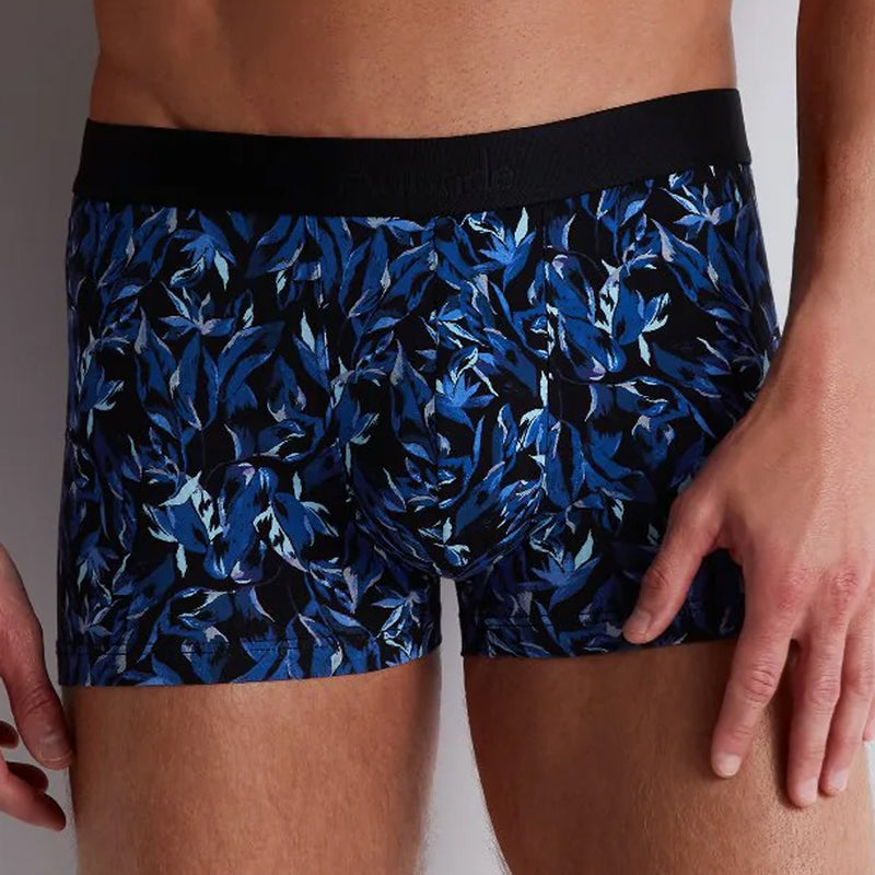 Model wearing 'Fleur Bleue' Blue Boxer Short, by Aubade (front view, close up).