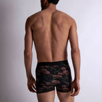Model wearing 'Blurred Flowers' Boxer Shorts by Aubade (back view).