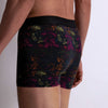Model wearing 'Fleurs Magiques' Boxer Shorts by Aubade (side back view).
