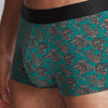 Model wearing 'Leopards' Boxer Short in Green, by Aubade (close-up).