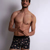 Model wearing 'Tarot' Boxer Short in Black, by Aubade (front view).