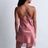 Model wearing 'Midnight Whisper' Warm Pink Silk Nightie, by Aubade (back view).
