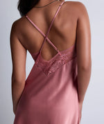 Model wearing 'Midnight Whisper' Warm Pink Silk Nightie, by Aubade (back view).