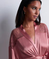 Model wearing 'Midnight Whisper' Warm Pink Silk Kimono, by Aubade (front view, close up).