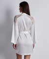 Model wearing 'Midnight Whisper' Opale (Ivory) Silk Kimono, by Aubade (back view).