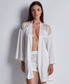 Model wearing 'Midnight Whisper' Opale (Ivory) Silk Kimono, by Aubade (front view).