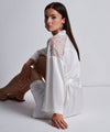 Model wearing 'Midnight Whisper' Opale (Ivory) Silk Kimono, by Aubade (side view).