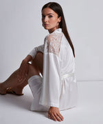 Model wearing 'Midnight Whisper' Opale (Ivory) Silk Kimono, by Aubade (side view).