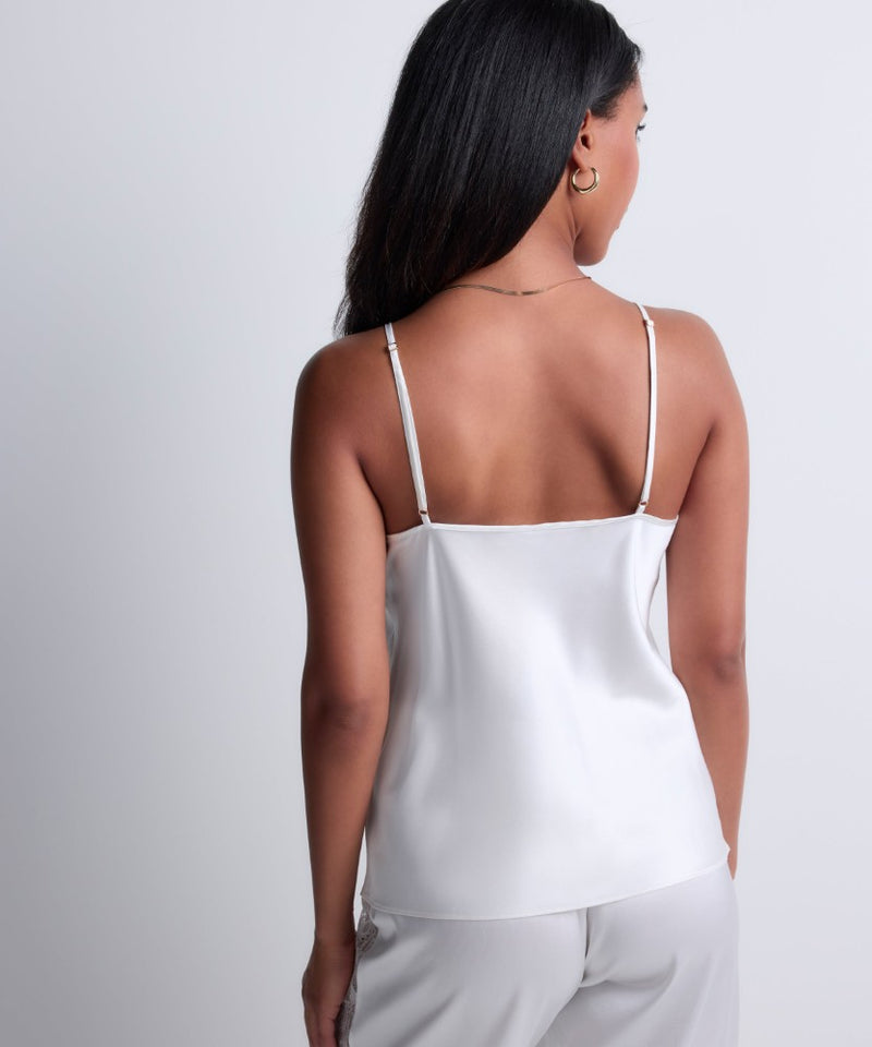 Model wearing 'Midnight Whisper' Opal White Camisole, by Aubade (back view, close up).