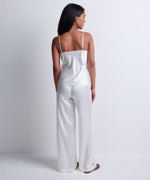 Model wearing 'Midnight Whisper' Opal White Camisole, by Aubade (back view).