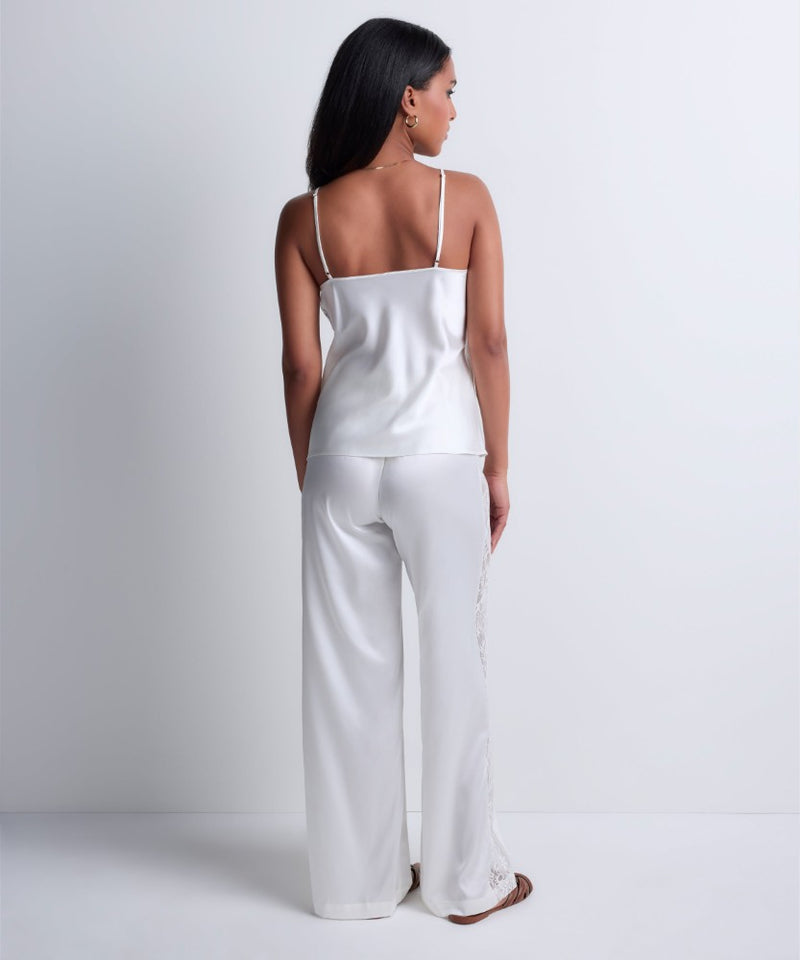 Model wearing 'Midnight Whisper' Opal White Camisole, by Aubade (back view).