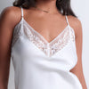 Model wearing 'Midnight Whisper' Opal White Camisole, by Aubade (front view, close up).