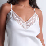 Model wearing 'Midnight Whisper' Opal White Camisole, by Aubade (front view, close up).