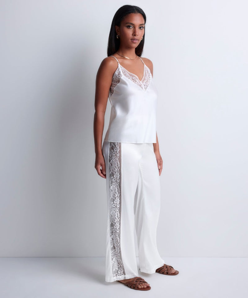 Model wearing 'Midnight Whisper' Opal White Camisole, by Aubade (side view).