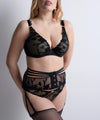 Plus size model wearing 'Night at Paradise' Black Waistcincher, by Aubade (front view).