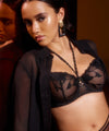 Model wearing 'Night at Paradise' Black Half Cup Bra, by (front view, close up).