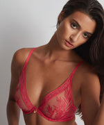 Model wearing 'Paranthese Tropicale' Triangle Bra in red by Aubade.