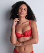 Model wearing 'Rules of Attraction' Red Underwired Half Cup Bra, by Aubade (front view).