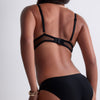 Model wearing 'Sheer Emotion' Black Brazilian Brief, by Aubade (back view).
