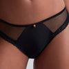 Model wearing 'Sheer Emotion' Black Brazilian Brief, by Aubade (front view, close up).