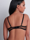 Model wearing 'Sheer Emotion' Black Bralette, by Aubade (back view).