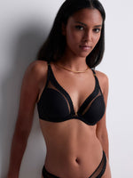 Model wearing 'Sheer Emotion' Black Bralette, by Aubade (front view).