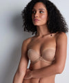 Model wearing 'Sheer Emotion' Sand Moulded Strapless Bra, by Aubade (front view).