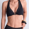Model wearing 'Summer Stars' Black Halterneck Bikini Set, by Aubade Swim (front view, close up).