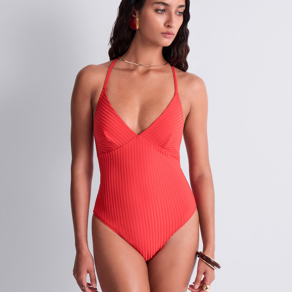 Model wearing Swim 'Sun Pop' Coral Swimsuit, by Aubade (front view).