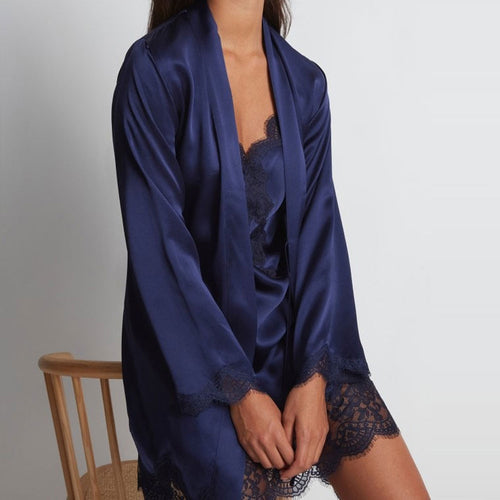 Model wearing 'Toi Mon Amour' Midnight Blue Silk Kimono, by Aubade (close-up).